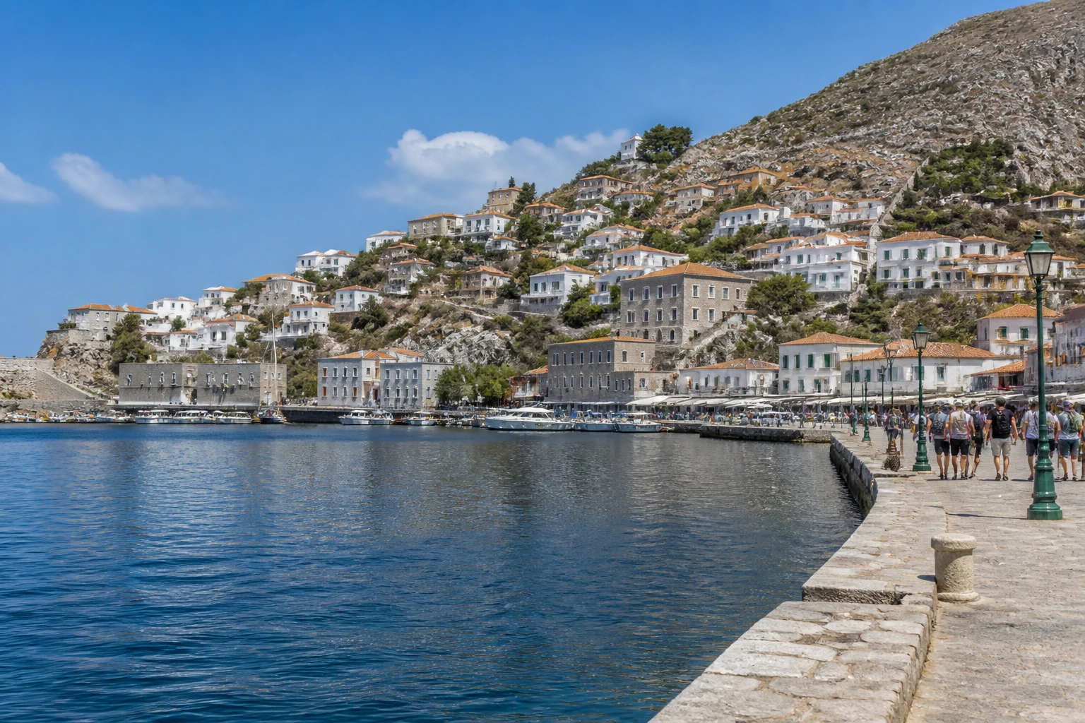 Representative cruise port destination view: Hydra, Greece; passenger waterfront and harbor water, not an exact landmark photograph.