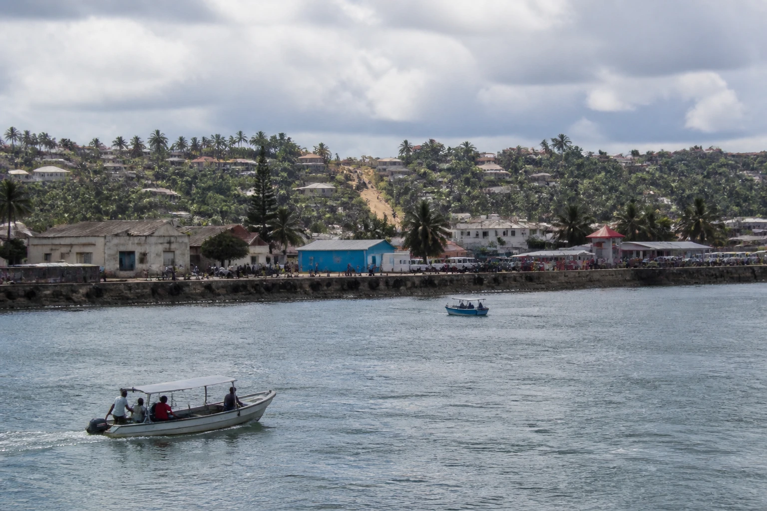 Representative cruise port destination view: Pomene, Mozambique; passenger waterfront and harbor water, not an exact landmark photograph.