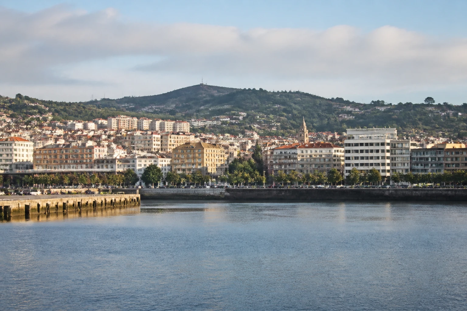 Representative cruise port destination view: Ferrol, Spain; passenger waterfront and harbor water, not an exact landmark photograph.