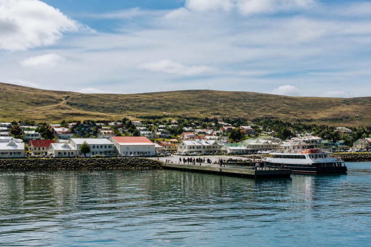 Representative cruise port destination view: Port Stanley, Falkland Islands; passenger waterfront and harbor water, not an exact landmark photograph.