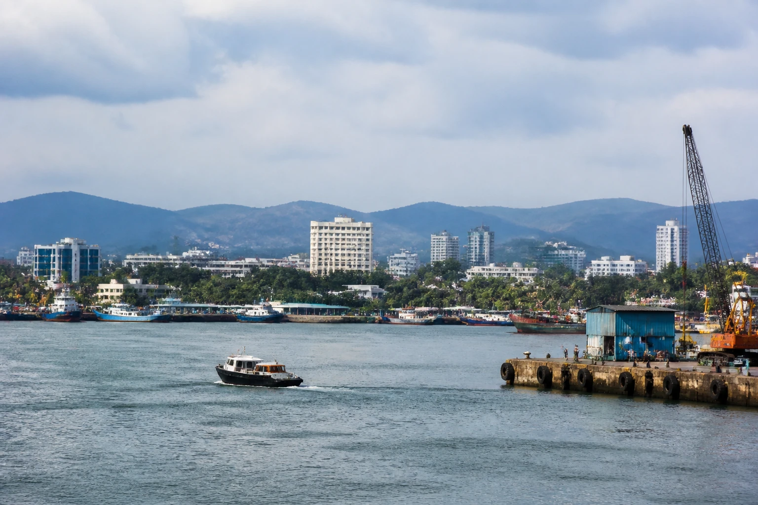 Representative cruise port destination view: Mangalore, India; passenger waterfront and harbor water, not an exact landmark photograph.