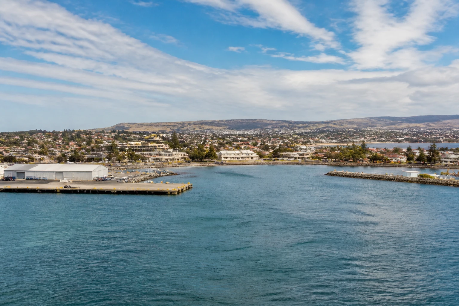 Representative cruise port destination view: Port Lincoln, Australia; passenger waterfront and harbor water, not an exact landmark photograph.