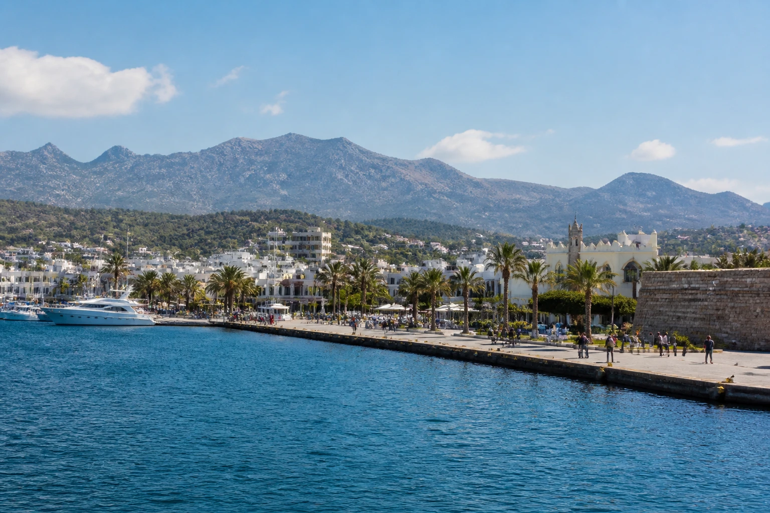 Representative cruise port destination view: Kos, Greece; passenger waterfront and harbor water, not an exact landmark photograph.