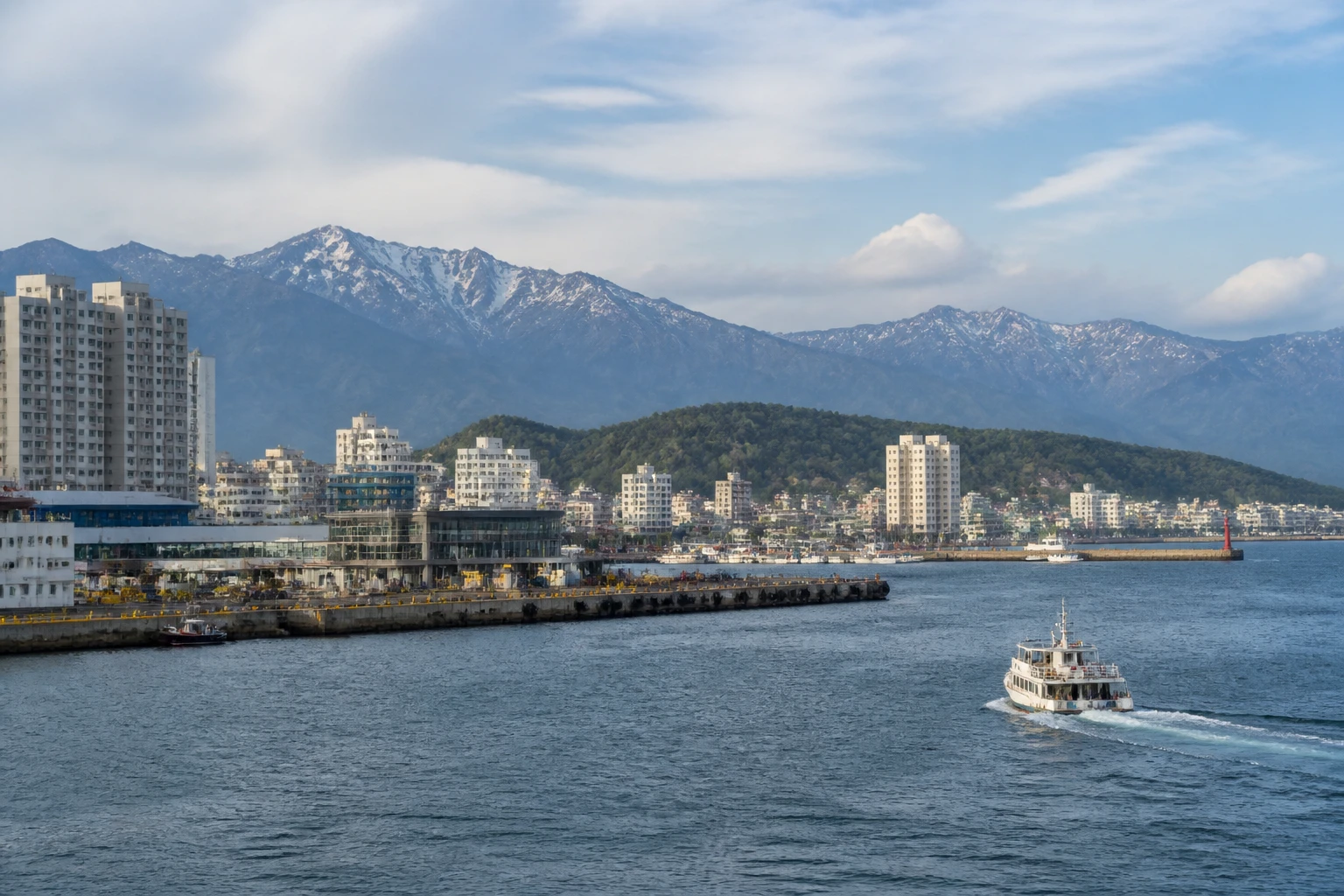 Representative cruise port destination view: Sokcho, South Korea; passenger waterfront and harbor water, not an exact landmark photograph.