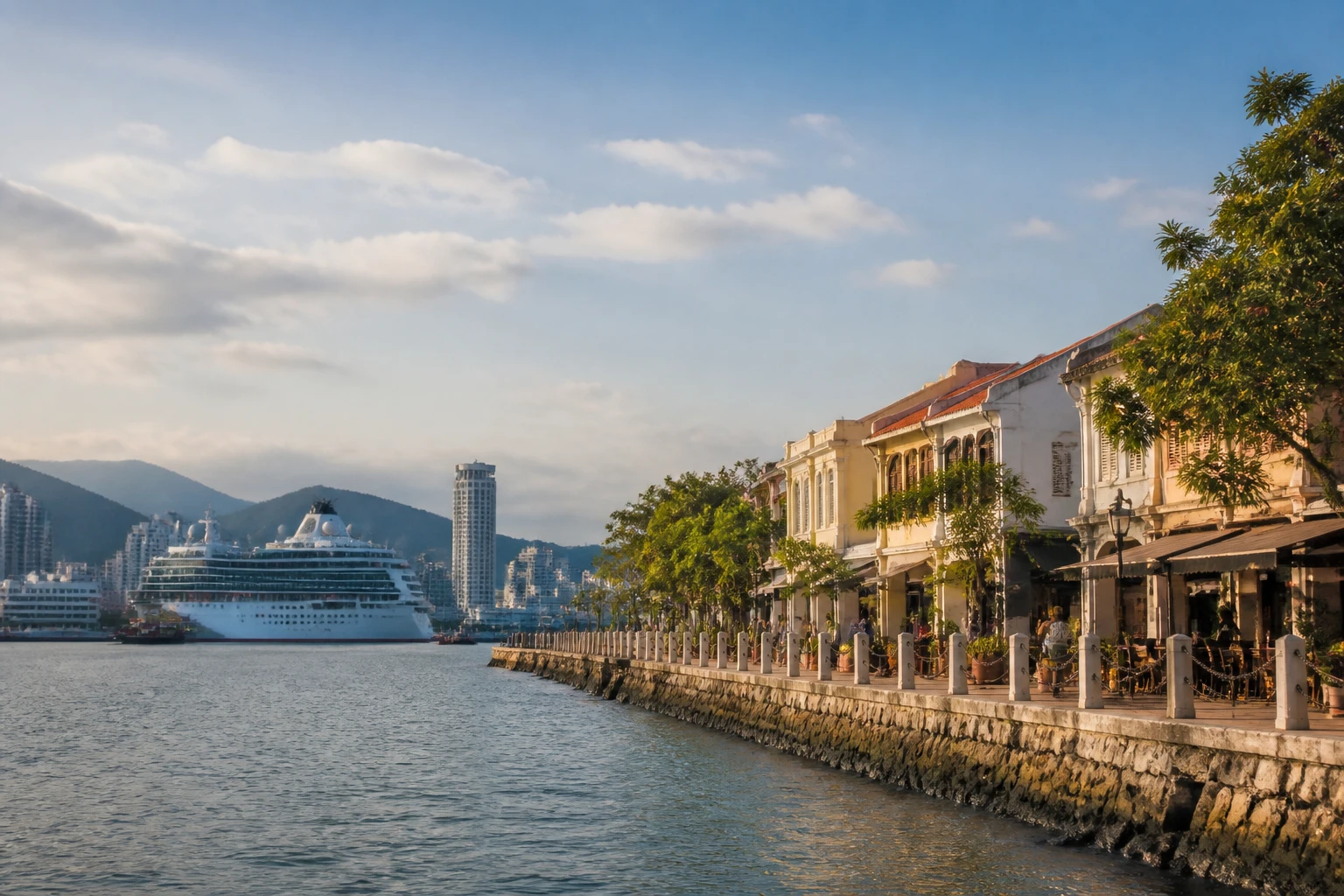Representative island destination view: Penang, Malaysia; coastline and regional vegetation, not an exact landmark photograph.