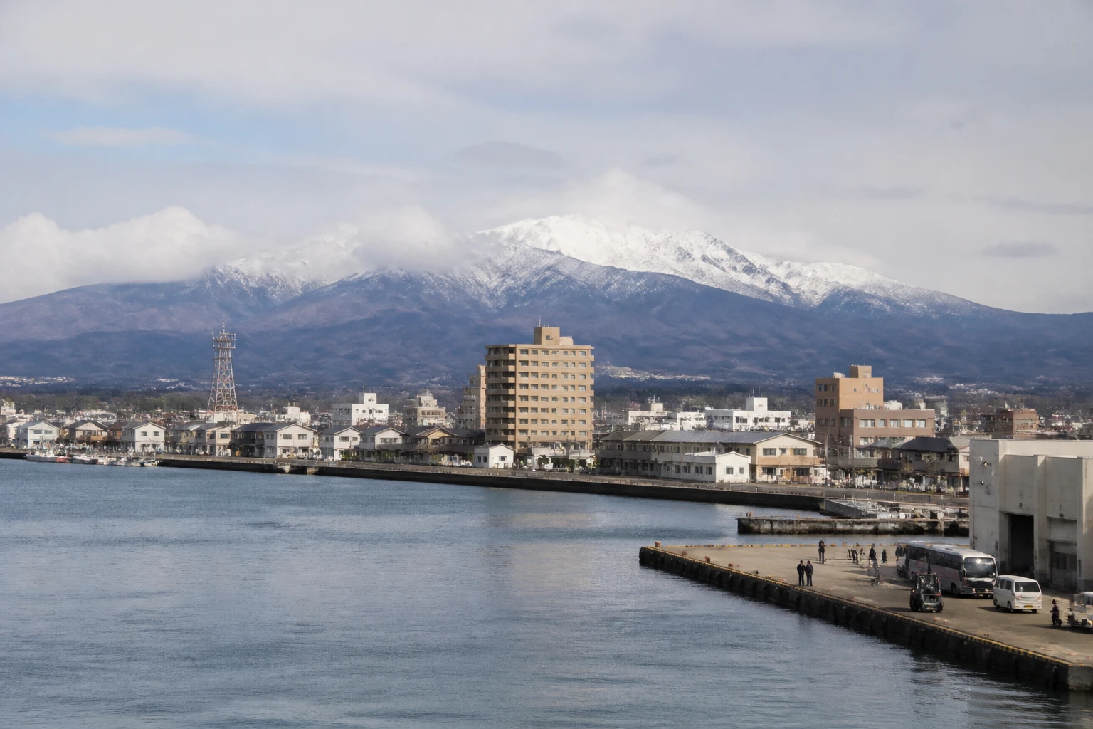 Representative cruise port destination view: Sakata, Japan; passenger waterfront and harbor water, not an exact landmark photograph.