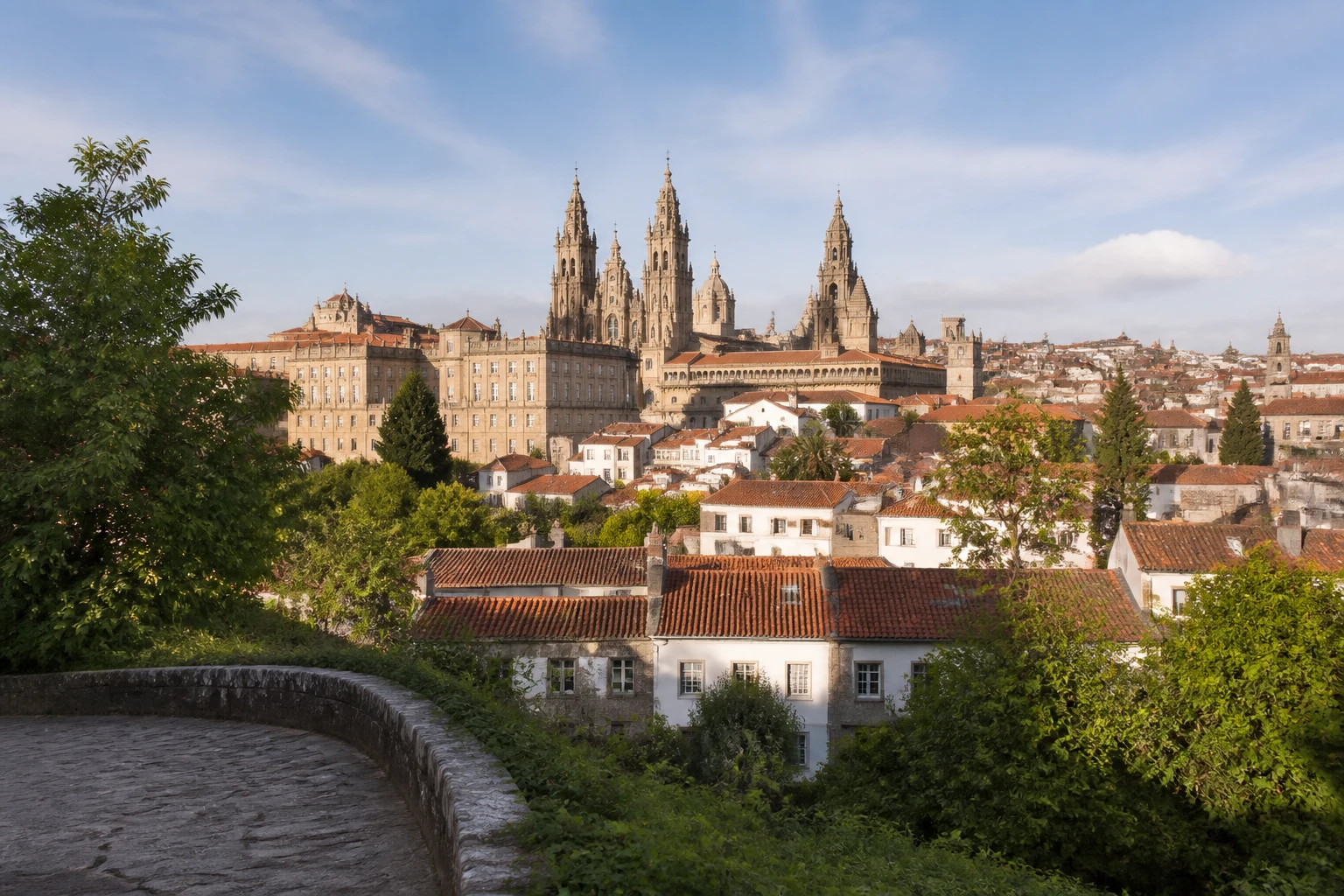 Representative city destination view: Santiago de Compostela, Spain; heritage-scale streetscape and regional architecture, not an exact landmark photograph.