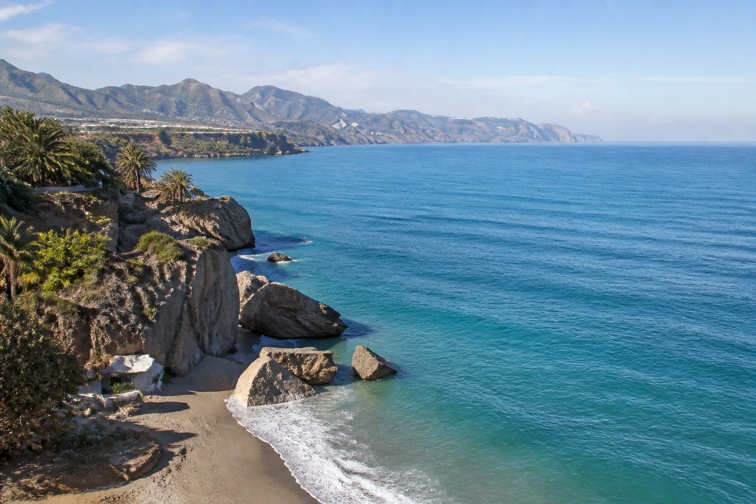 Representative coastal destination view: Malaga and Costa del Sol, Spain; coastline and regional vegetation, not an exact landmark photograph.