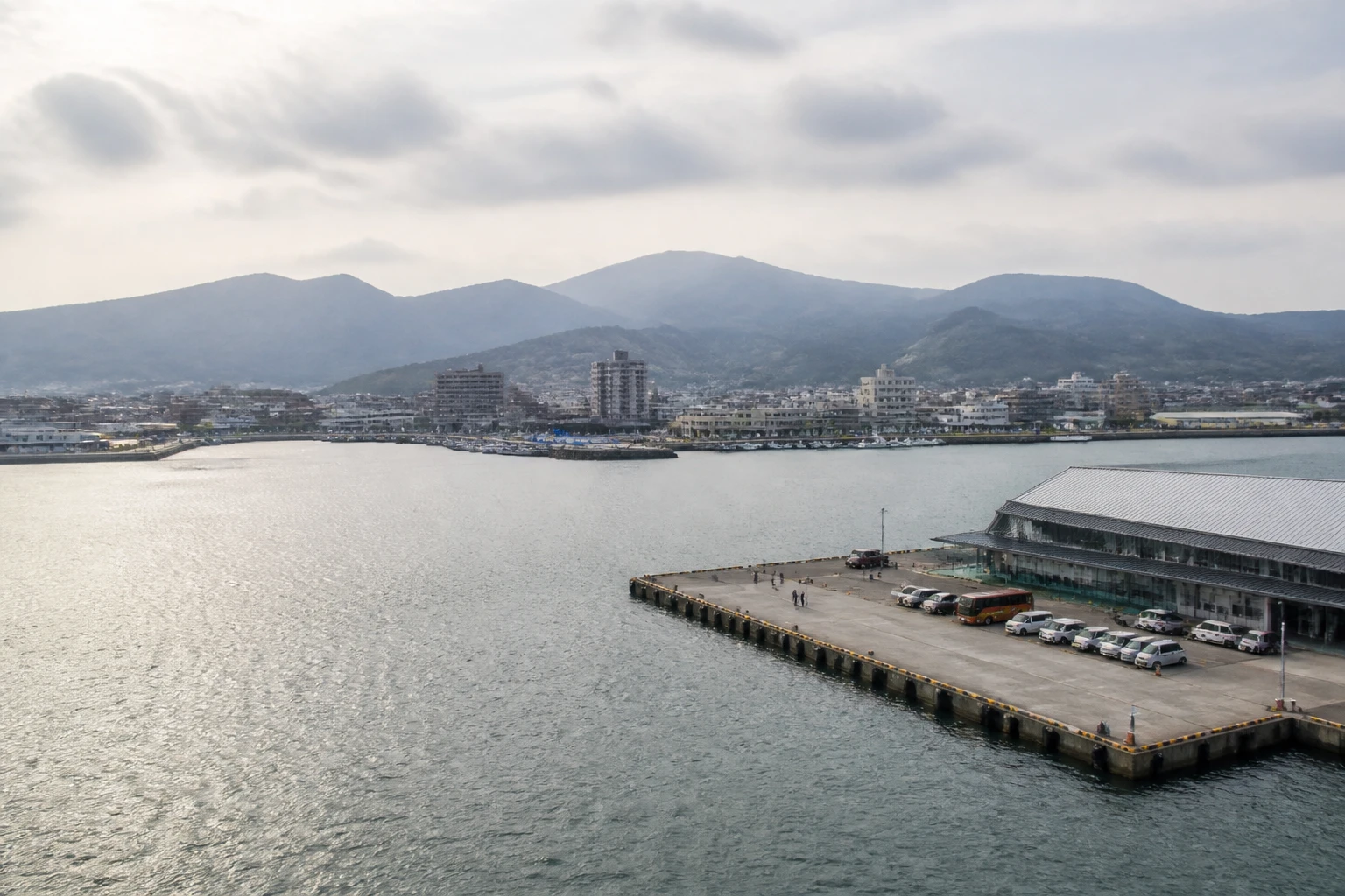 Representative cruise port destination view: Sakaiminato, Japan; passenger waterfront and harbor water, not an exact landmark photograph.