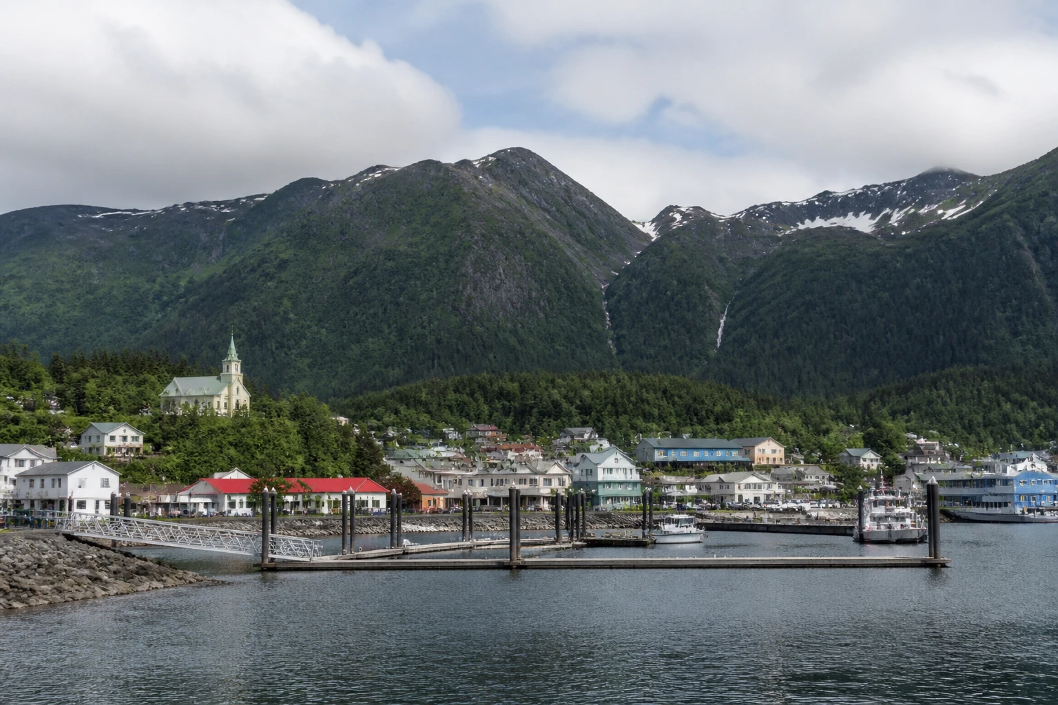 Representative cruise port destination view: Wrangell, United States; passenger waterfront and harbor water, not an exact landmark photograph.