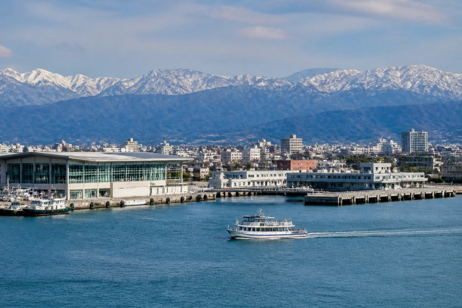 Representative cruise port destination view: Toyama, Japan; passenger waterfront and harbor water, not an exact landmark photograph.