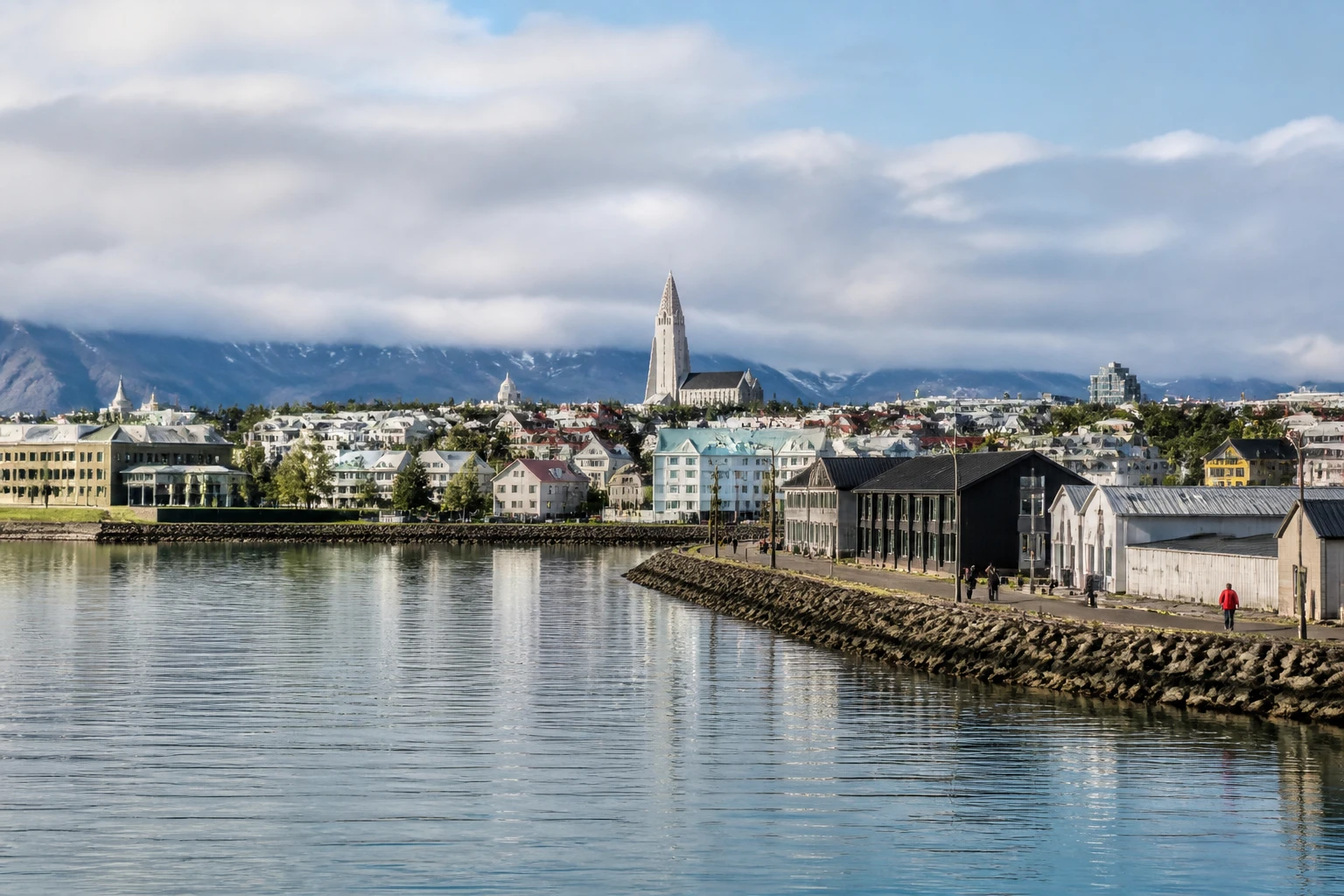 Representative city destination view: Reykjavik, Iceland; passenger waterfront and harbor water, not an exact landmark photograph.