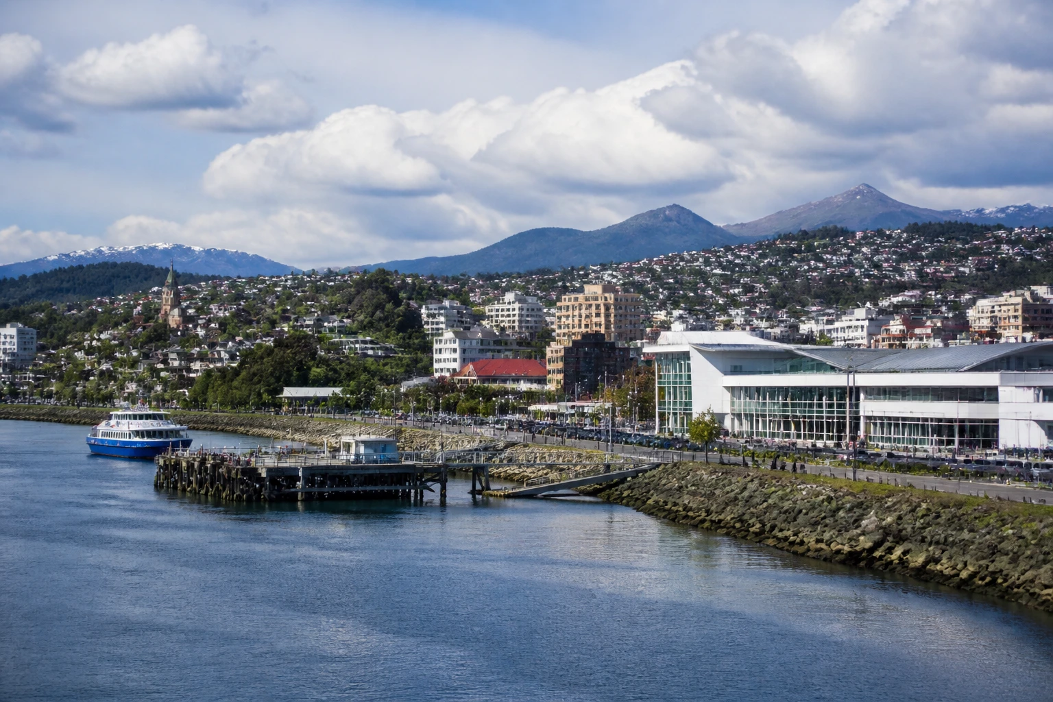 Representative cruise port destination view: Puerto Montt, Chile; passenger waterfront and harbor water, not an exact landmark photograph.