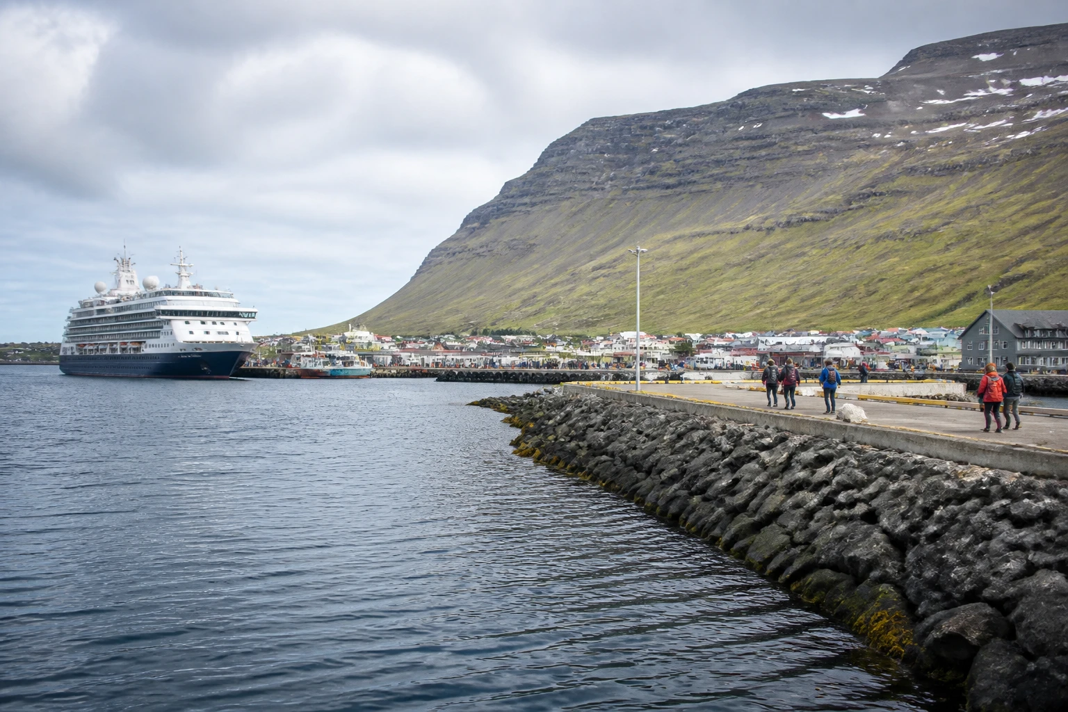 Representative cruise port destination view: Patreksfjordur, Iceland; passenger waterfront and harbor water, not an exact landmark photograph.