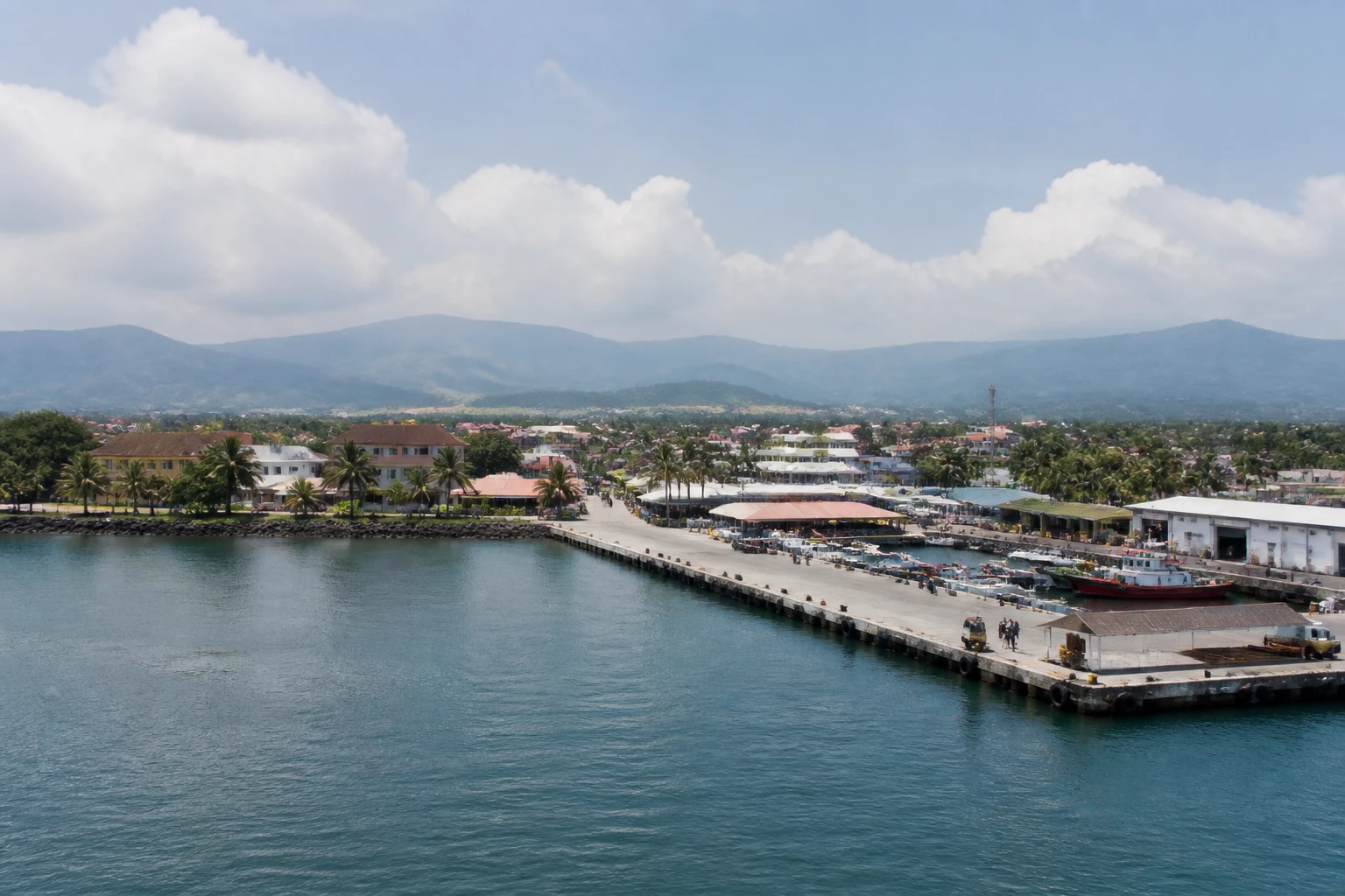 Representative cruise port destination view: Puerto Quetzal, Guatemala; passenger waterfront and harbor water, not an exact landmark photograph.