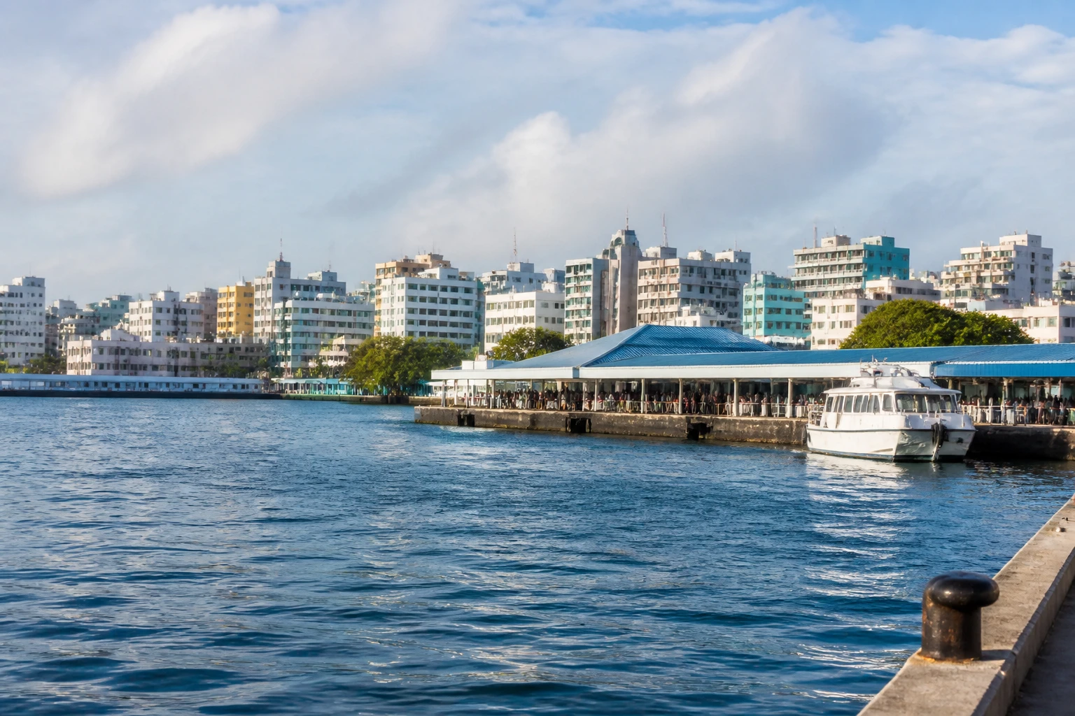 Representative cruise port destination view: Male, Maldives; passenger waterfront and harbor water, not an exact landmark photograph.