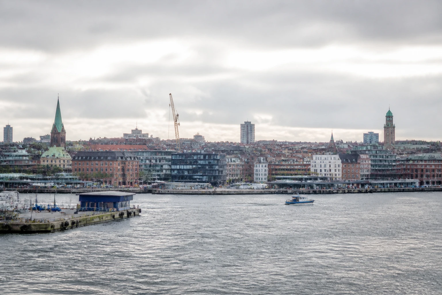Representative cruise port destination view: Aarhus, Denmark; passenger waterfront and harbor water, not an exact landmark photograph.