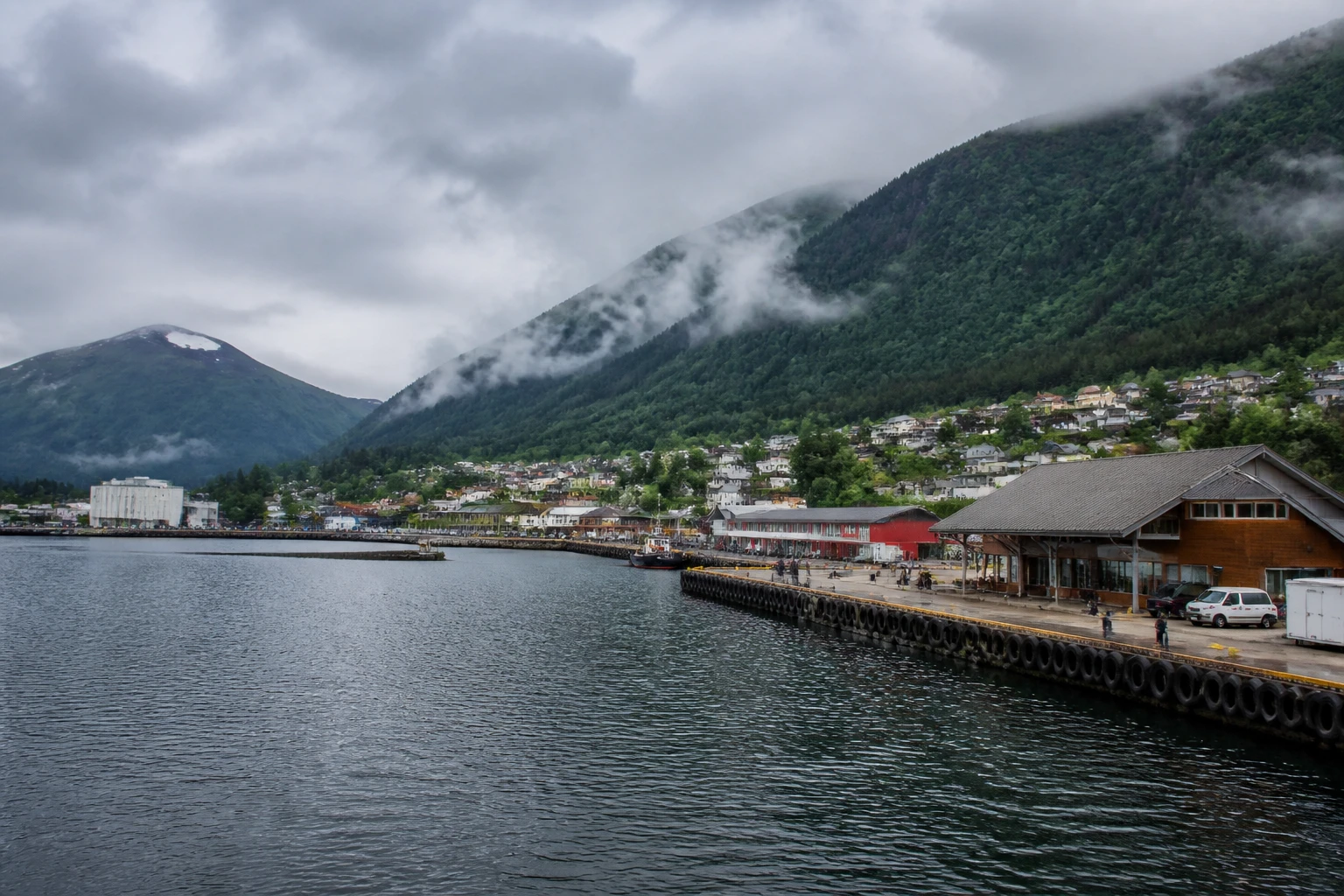 Representative cruise port destination view: Vik, Norway; passenger waterfront and harbor water, not an exact landmark photograph.