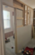 New wall separating sides of the bedroom