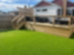 Astroturf installed in backyard and new backyard deck connected to the house
