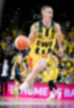 Trey Drechsel playing basketball overseas.