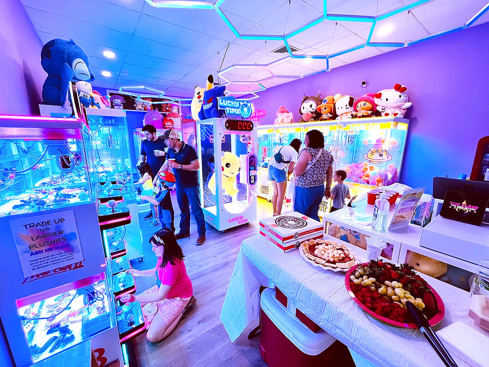 Eye-level view of a modern arcade venue with colorful claw machines