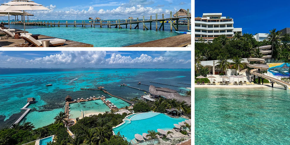 Scenic ocean view with clear turquoise water, a wooden pier, lounge chairs under umbrellas, resort buildings, and palm trees in the background.