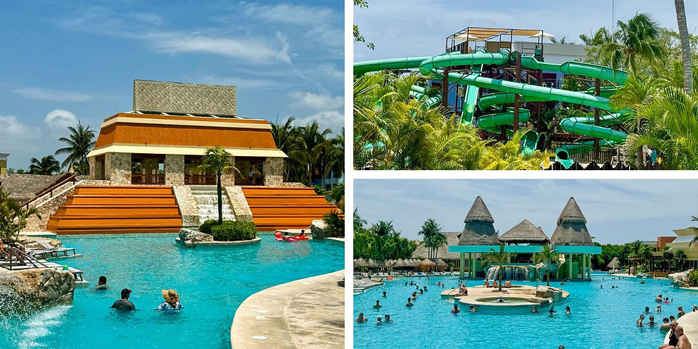 People enjoying a resort pool with slides, palm trees, and a Mayan-style building. Bright turquoise water and clear sky enhance the tropical vibe.