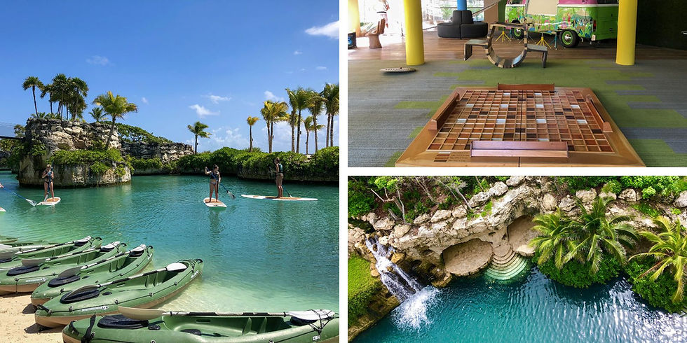 Paddleboarders on turquoise water, lush palm trees, kayaks on sandy beach. Indoors, colorful van and seating area. Tropical, serene setting.