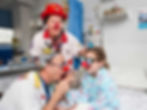 Healthcare clown duo in action bringing smiles and laughter.