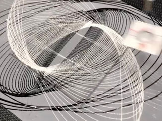 painting in black and white on a grey background using a pendulum to make spirals