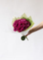Bouquet of chrysanthemum sprays wrapped in green paper