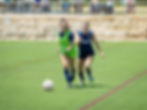 FIERCE player on the ball with a defender