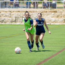 FIERCE player on the ball with a defender