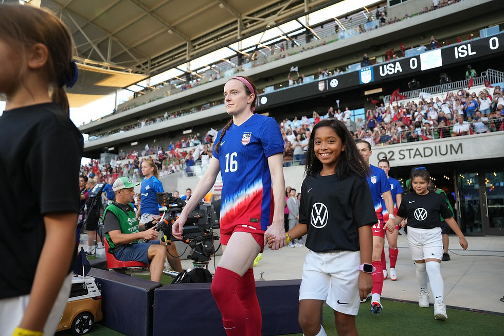 FIERCE Academy players walking out with Rose Lavelle and Sam Coffey
