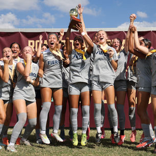 FIERCE G08 players lifting the trophy