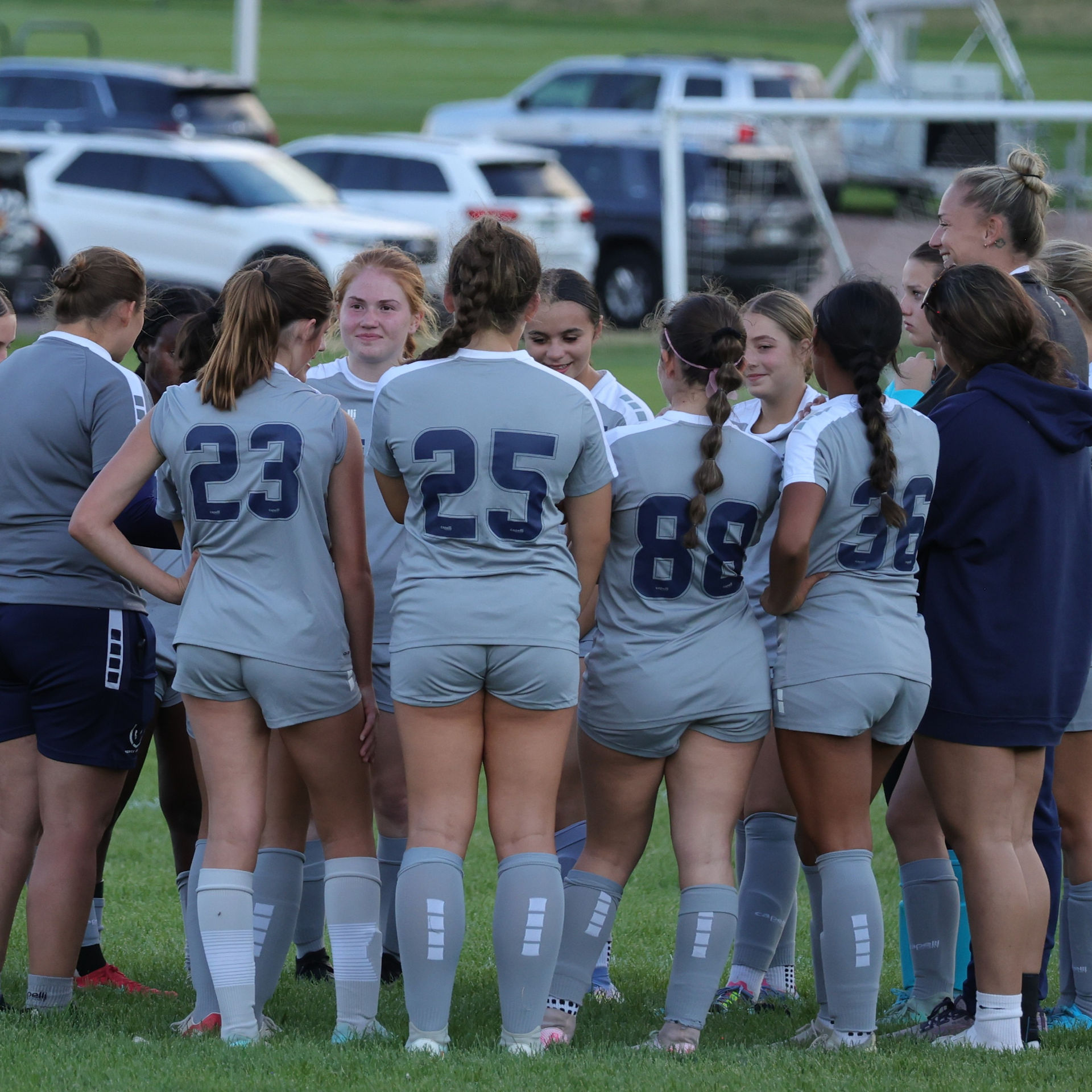 Rachelle D'Amico in a team huddle with FIERCE G09/10
