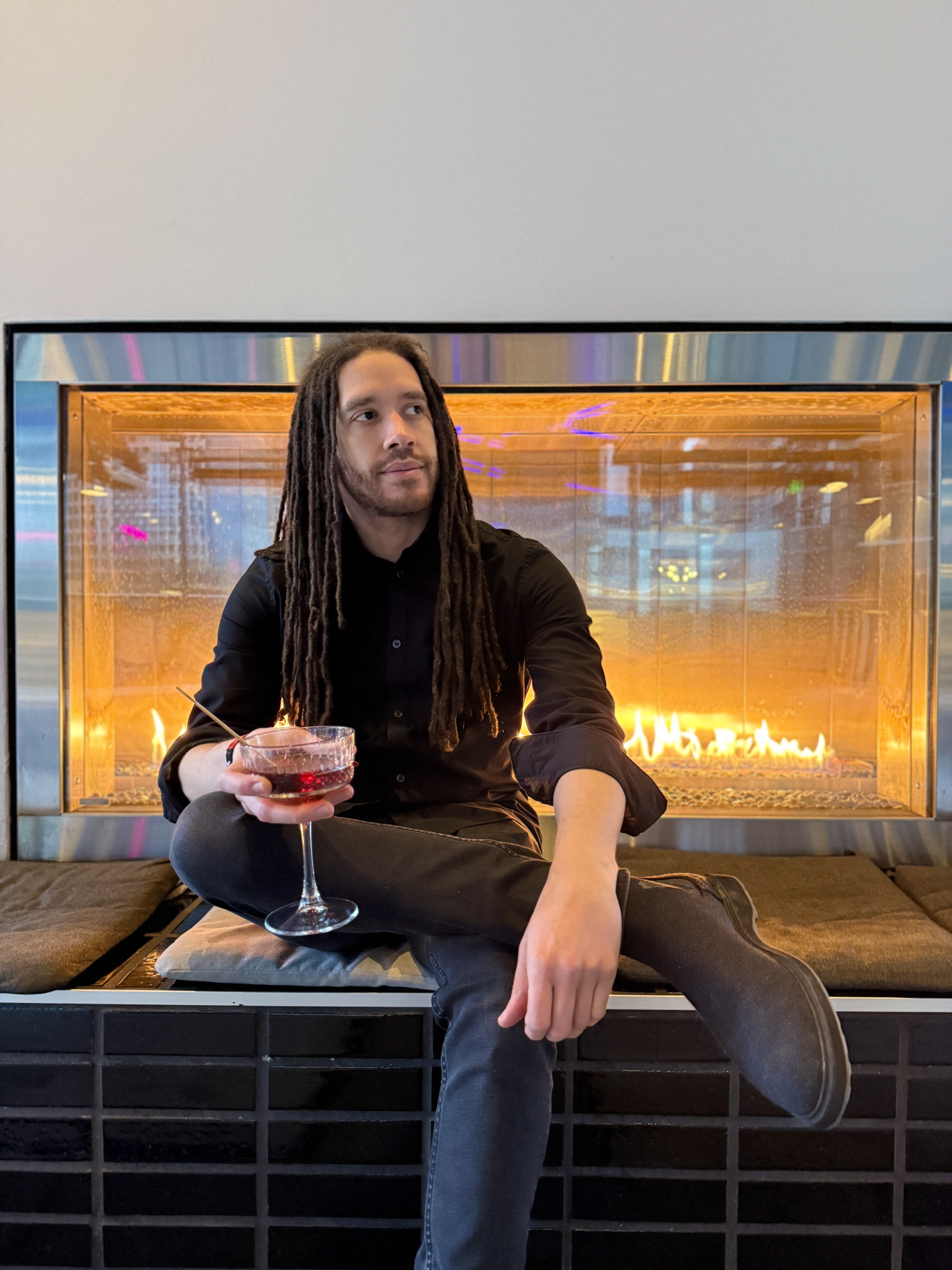 Professional dating app photo of a male client taken in a modern indoor setting in Seattle