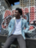 Man posing against urban graffiti wall stylish Tinder profile photo