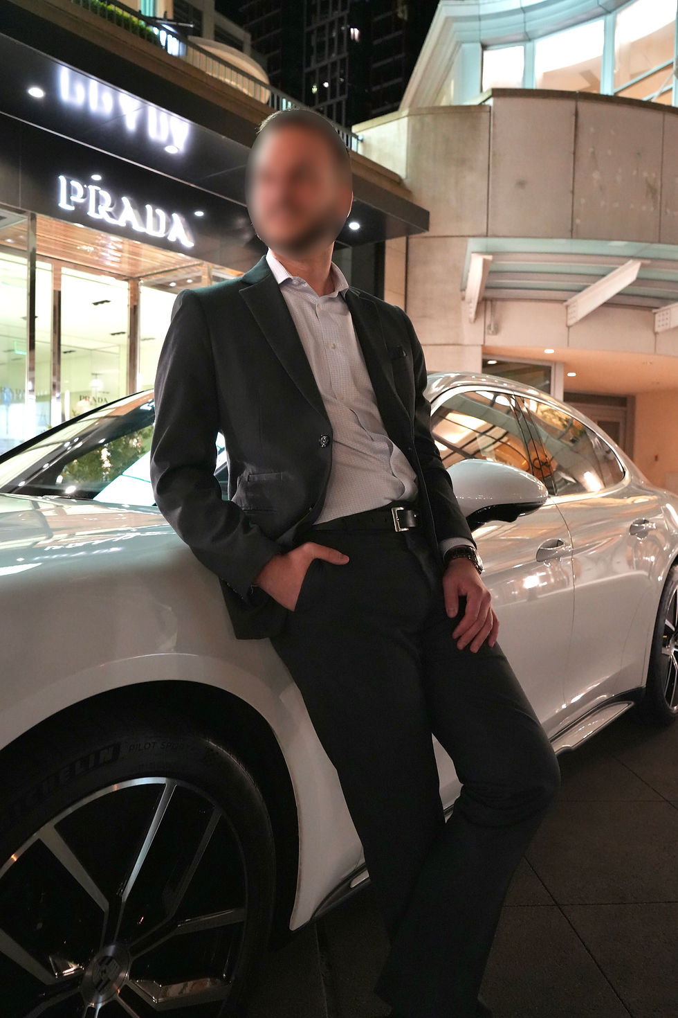 Client Steve posing beside a car during his professional photoshoot, representing Based Dating success story