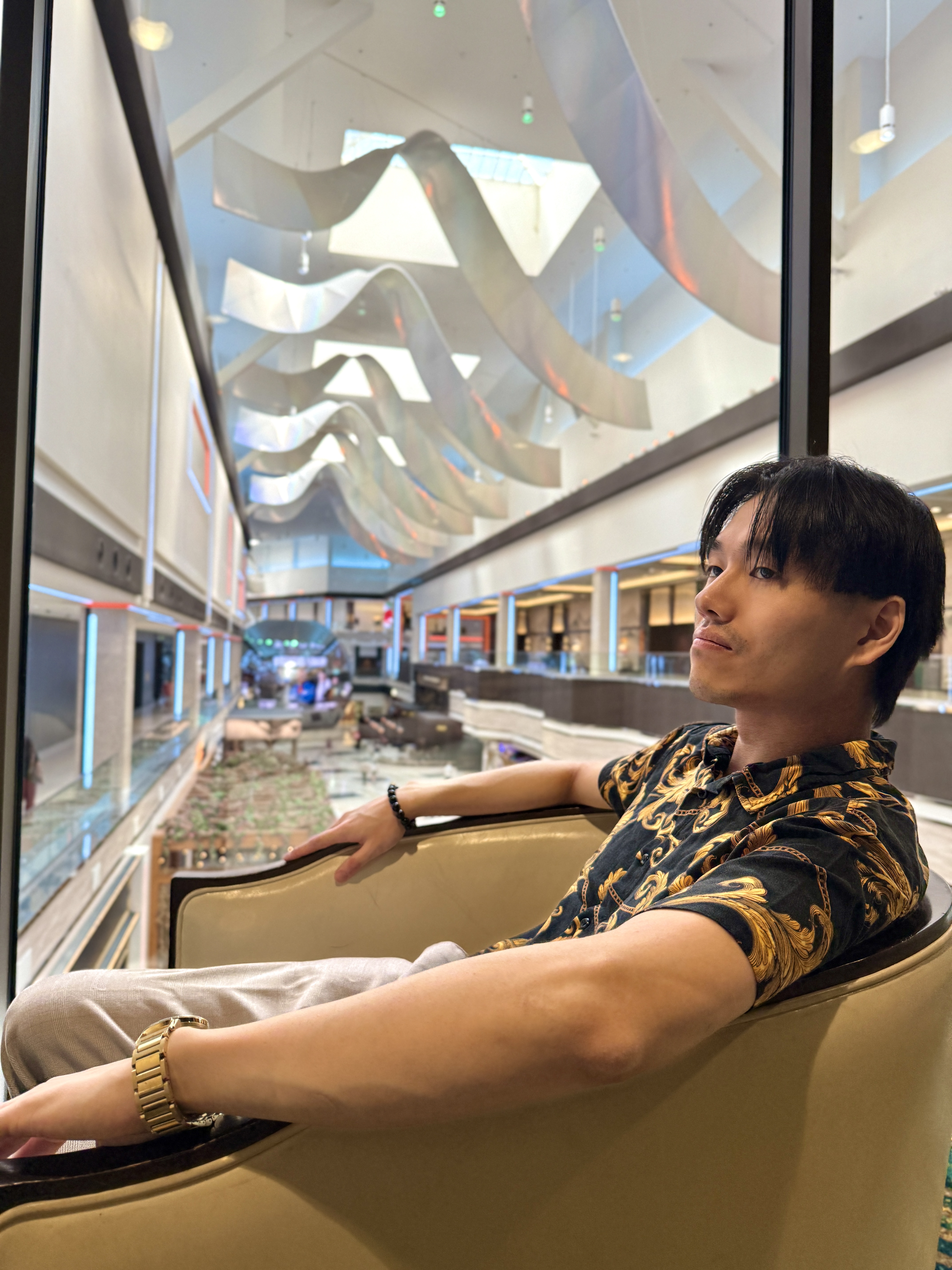 Professional dating app photoshoot in Las Vegas featuring a confident man in an upscale lounge setting, styled for high-quality dating profiles