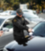 The Guard Giving a Ticket For An Illegally Parked Car