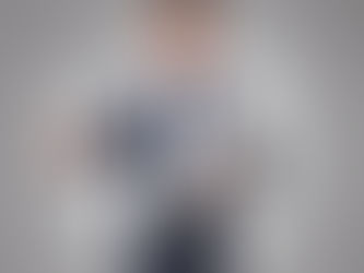 A man holding certificates standing up