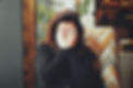 Woman sitting with head in hands, experiencing TMJ pain, receiving expert TMJ treatment at Spainhower Dental Care in Layton, Utah