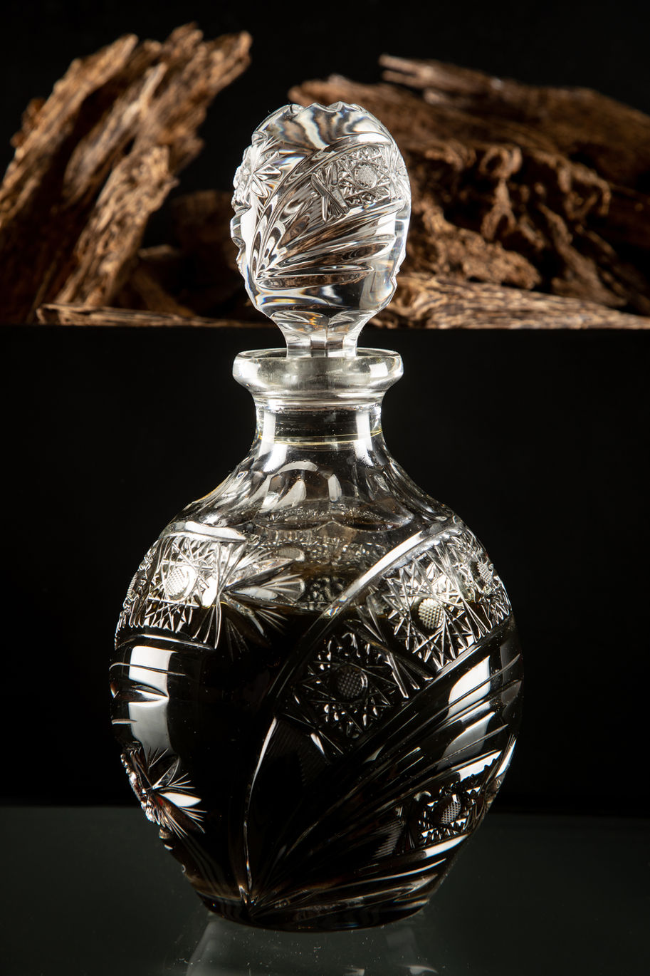 Luxury crystal decanter in dramatic lighting, captured for high-end beverage product photography in Dubai