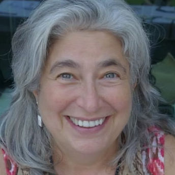 Michelle Schwartz a white female with medium lenght grey hair is smiling