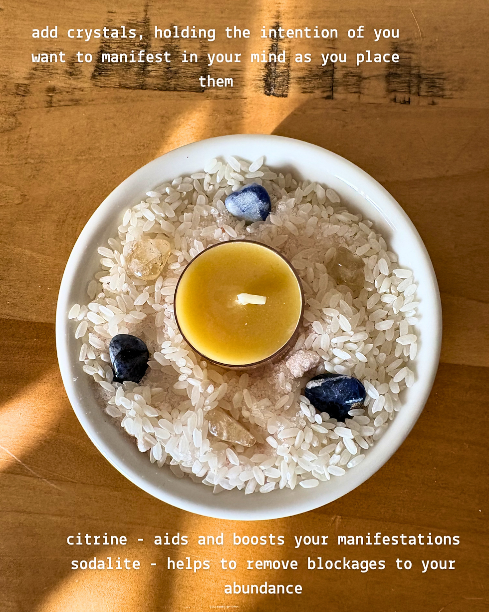 Manifestation abundance bowl with rice, salt, sodalite, citrine, and candle