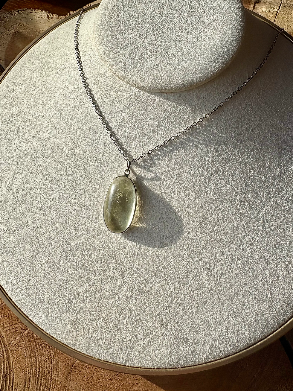 A light green prasiolite crystal silver necklace