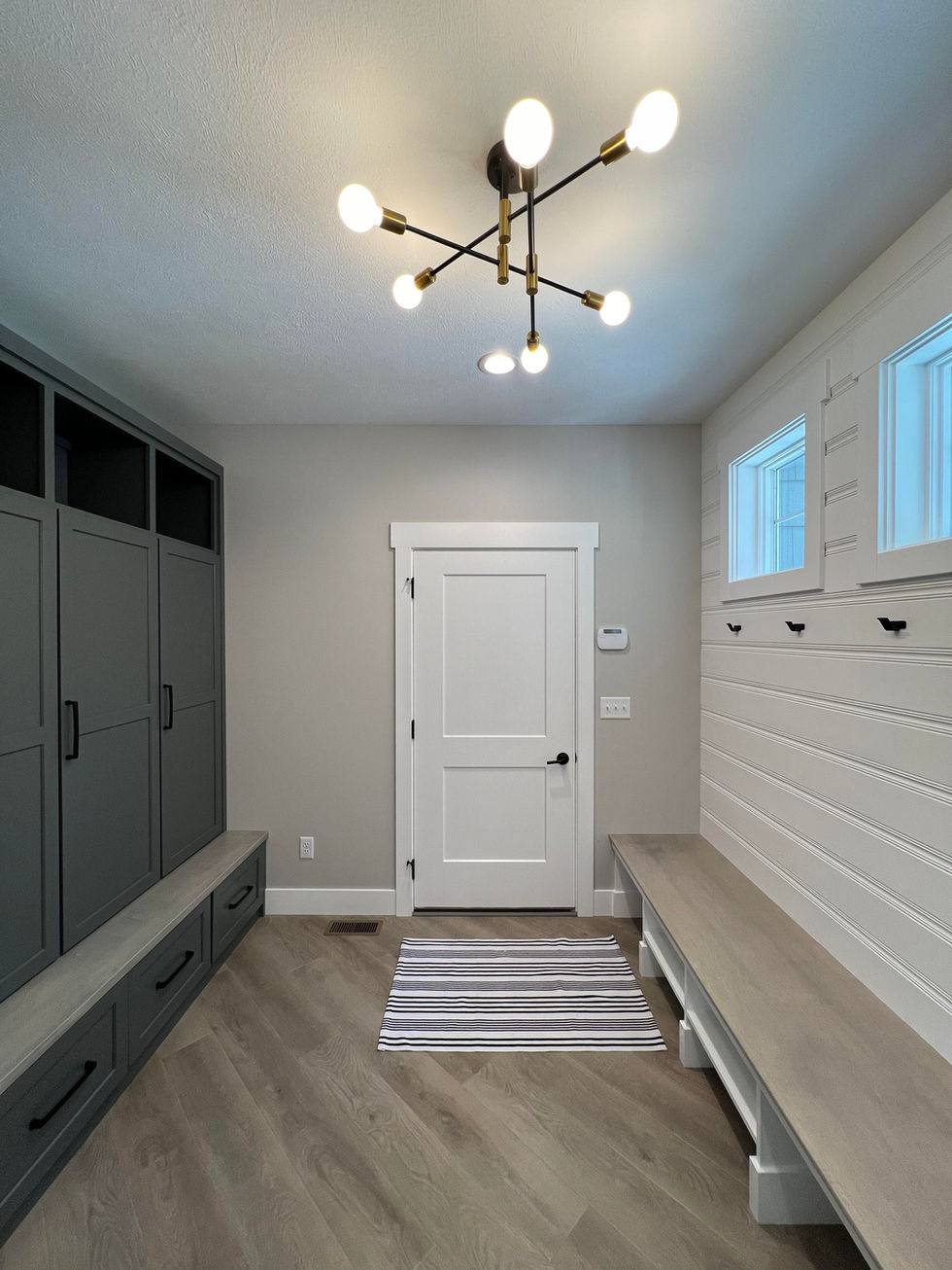 Mudroom hallway leading into the two car garage