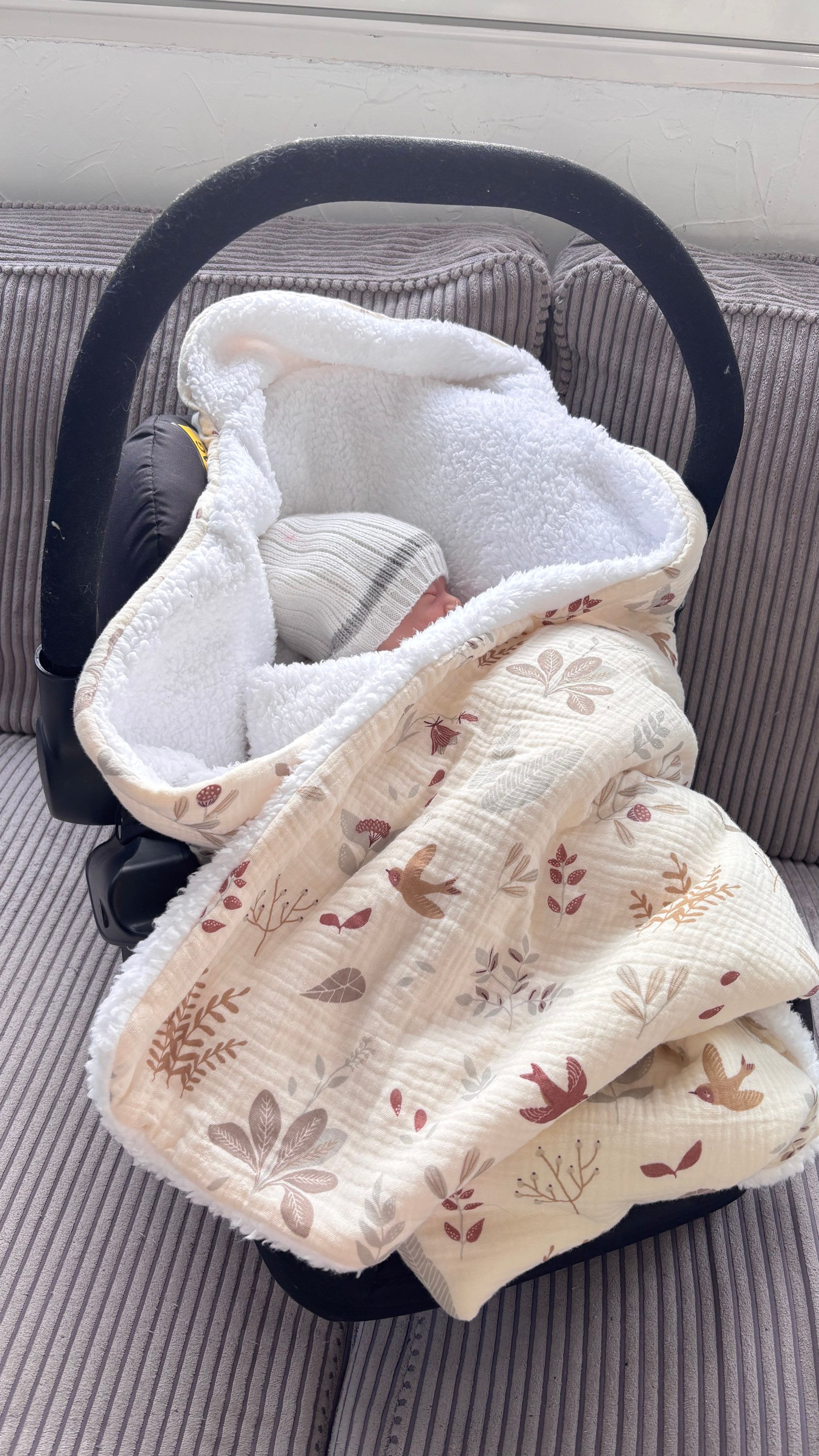 Nid d'ange pour cosy, nid d'ange avec ouverture pour passage des harnais